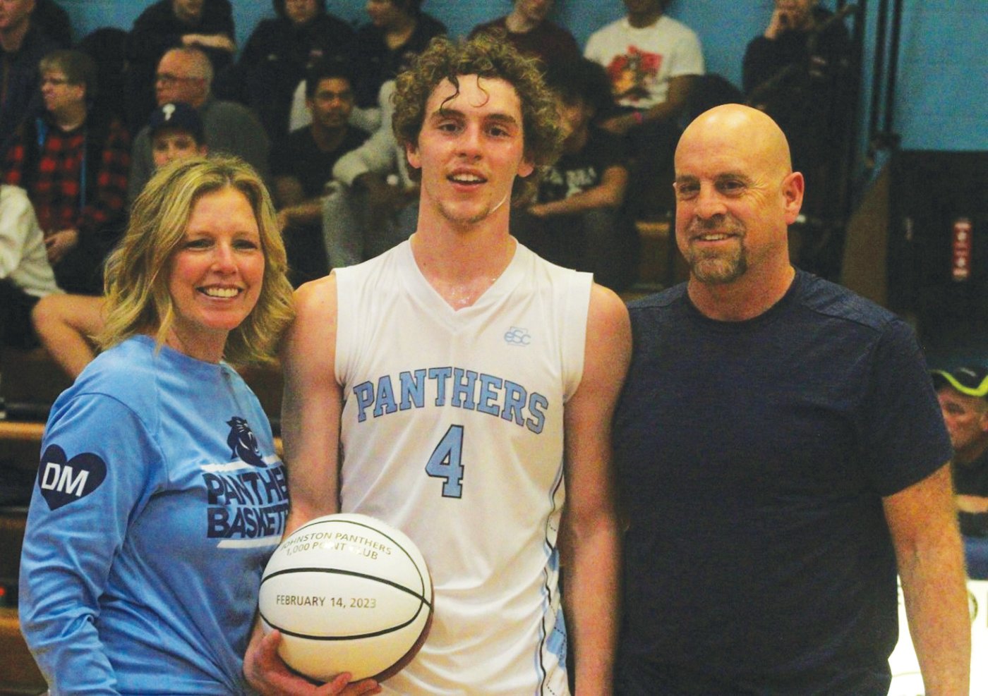 Derek Salvatore and his family after scoring his 1,000th point.